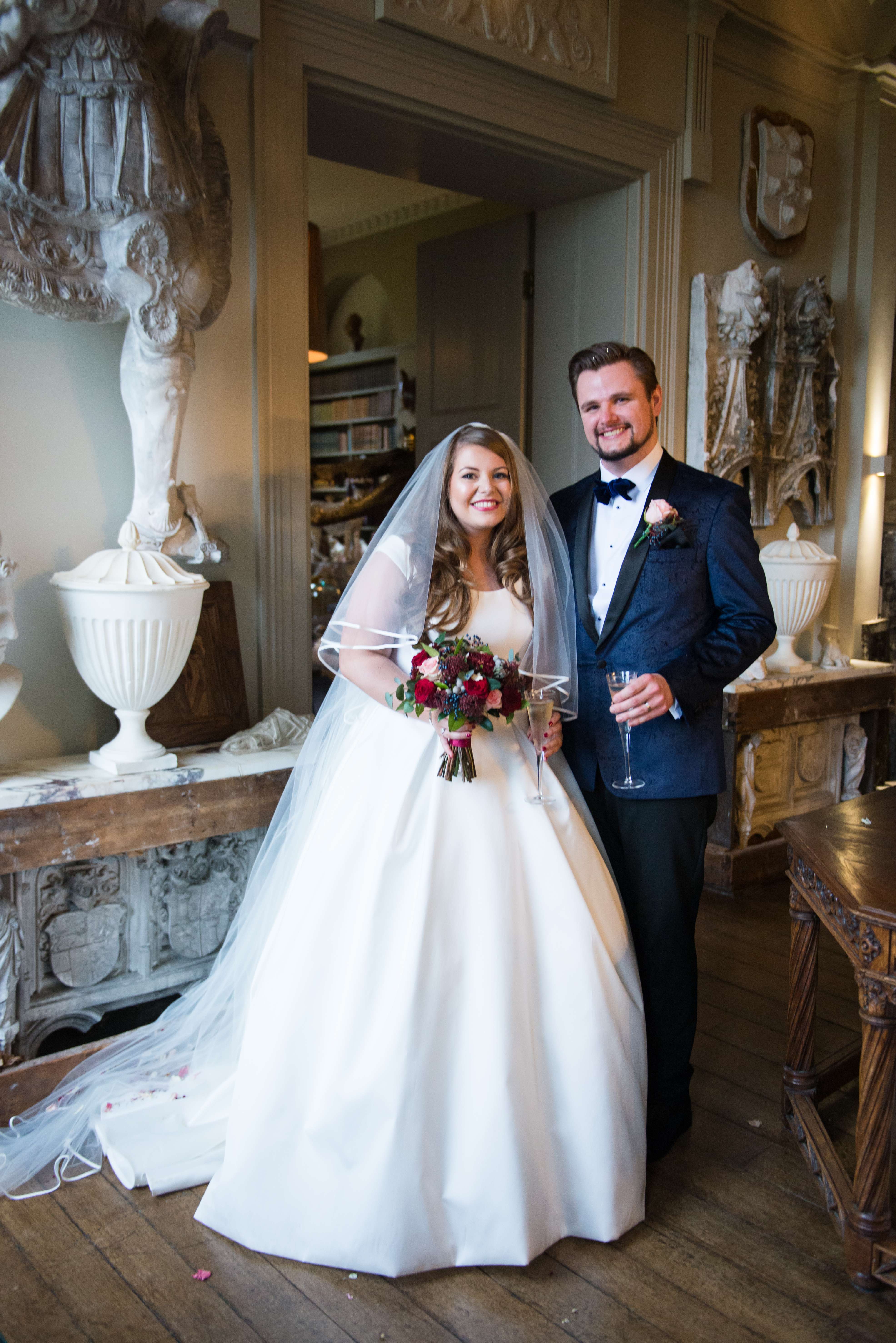 A wedding photograph at aynhoe park after the bride and groom have got married